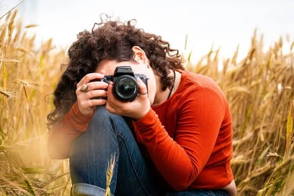 a person holding a camera